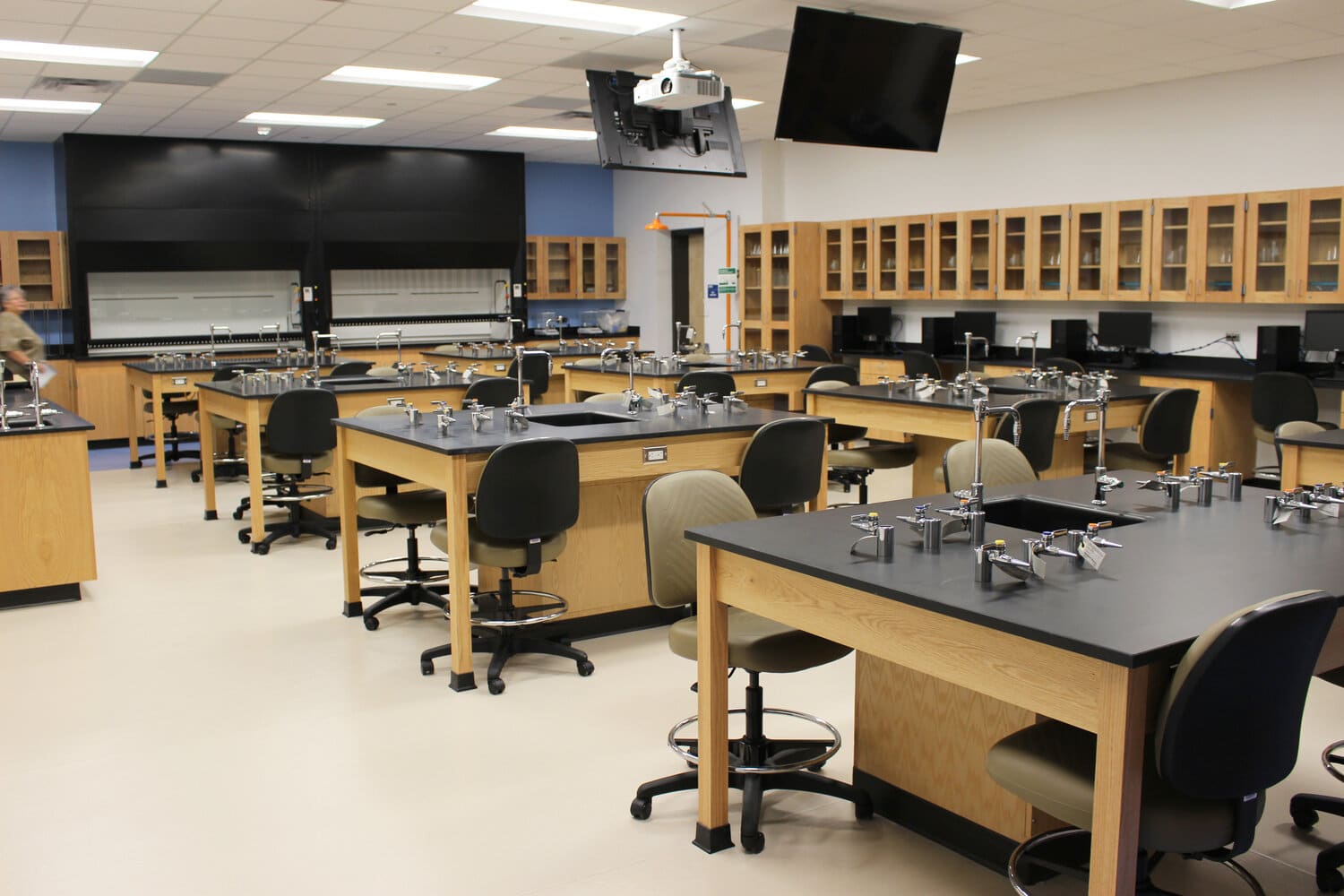Modern chemistry laboratory with equipment and furniture.