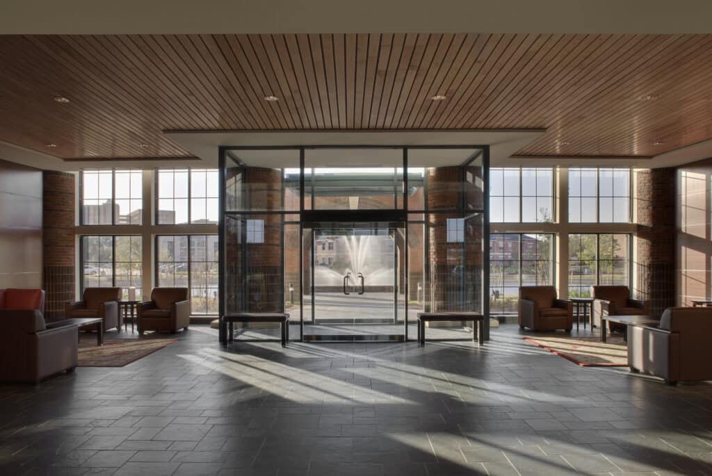 Modern lobby interior with sunlight and glass entrance