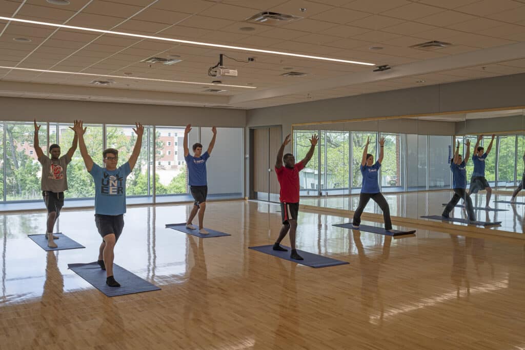 Group yoga class in session indoors.