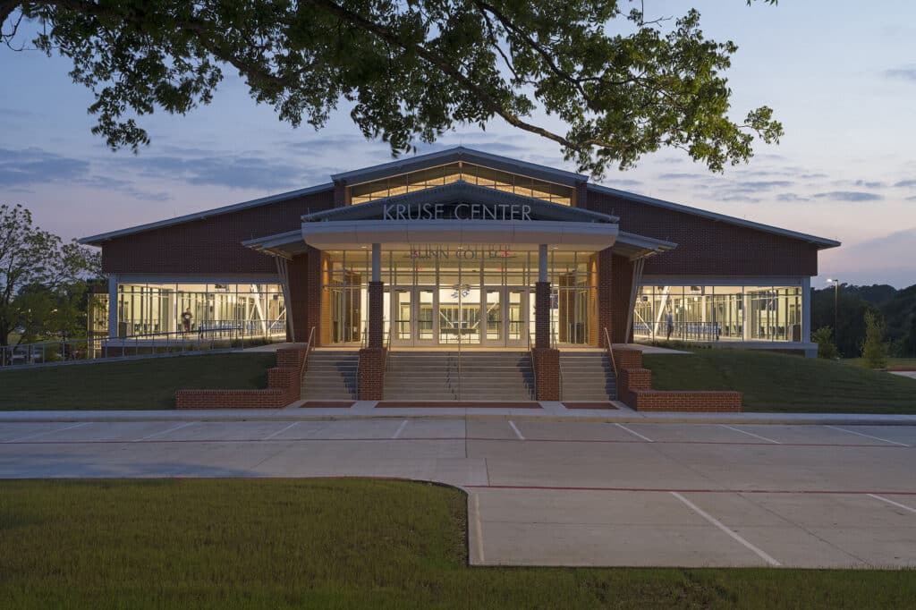 Kruse Center exterior at dusk, Blinn College campus.