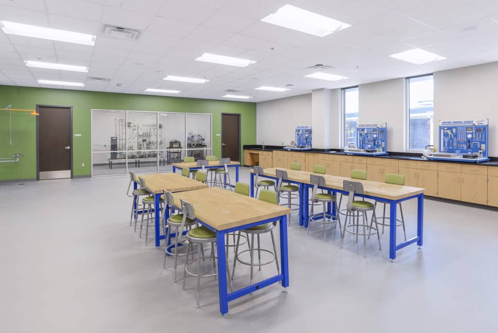 Modern science laboratory classroom interior with tables.