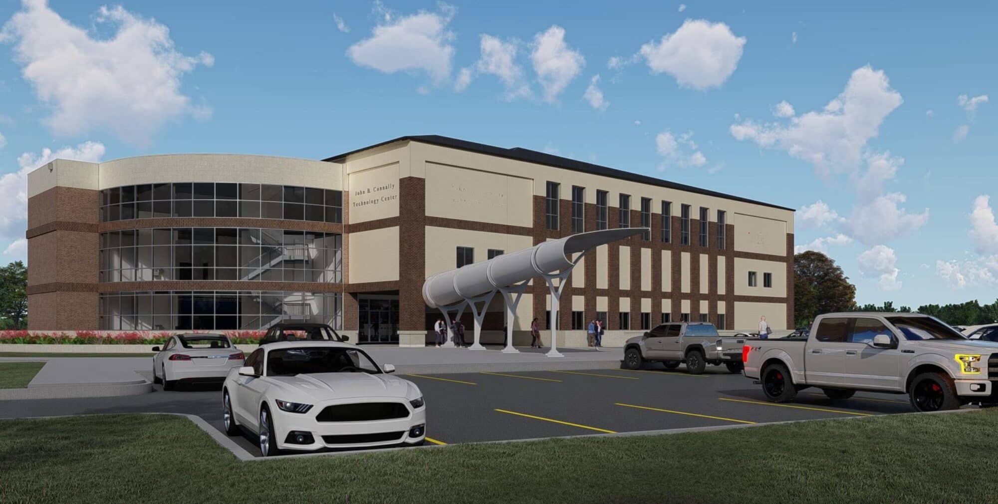 Modern building with exterior rocket display and parking lot.