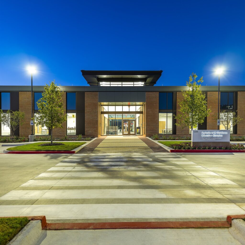 Modern educational building entrance at twilight.