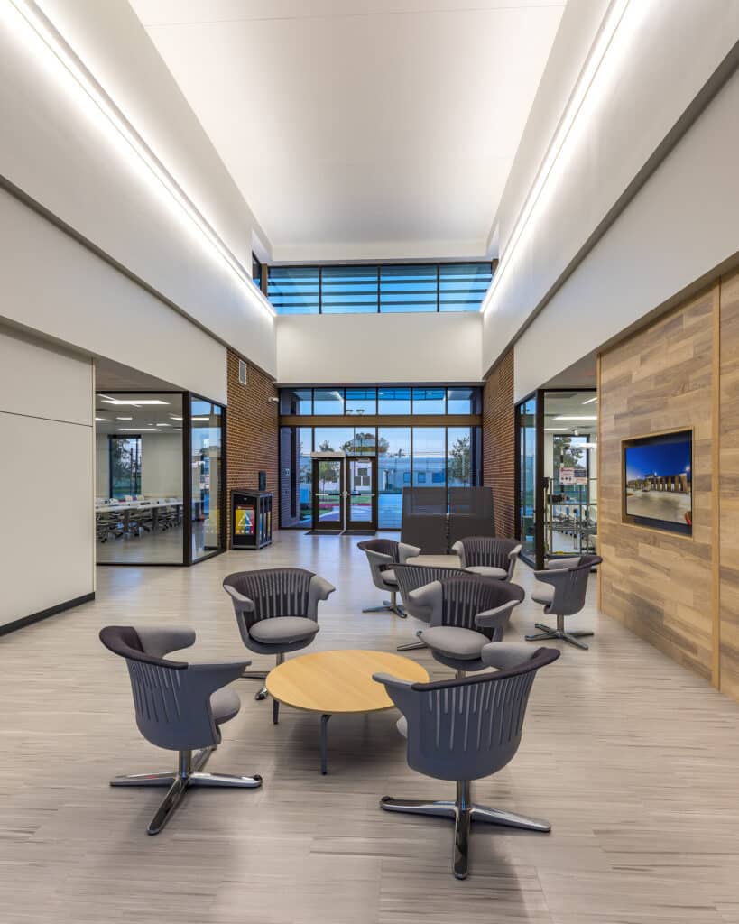 Modern office lobby with chairs and natural light.