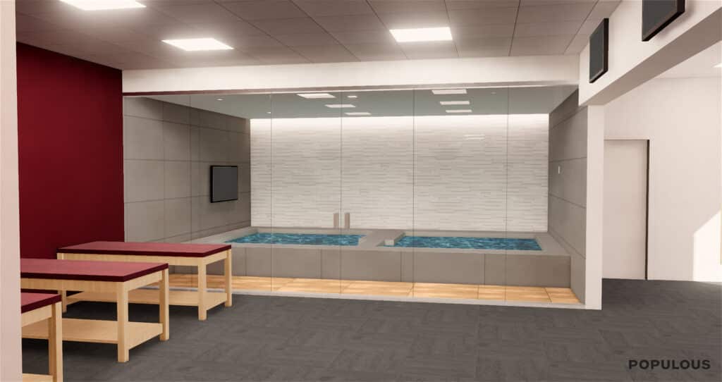 Modern indoor pool with benches and glass partition.