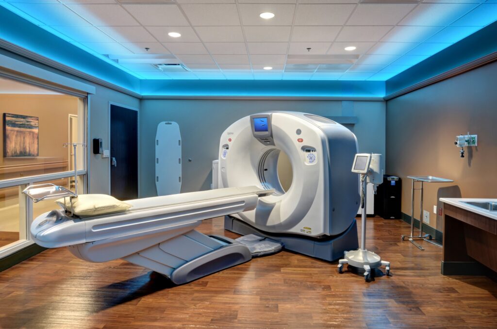 Modern CT scanner room in hospital.