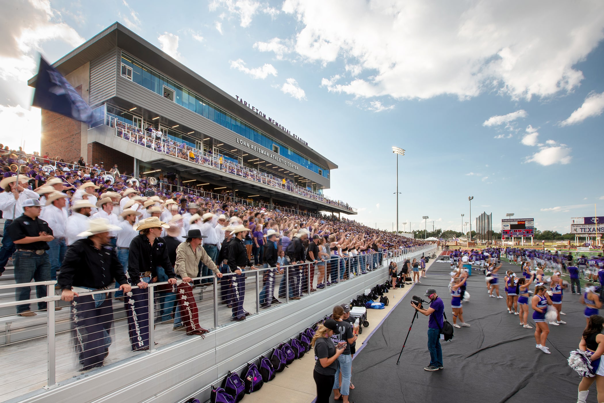 Crowd at outdoor sports stadium event.