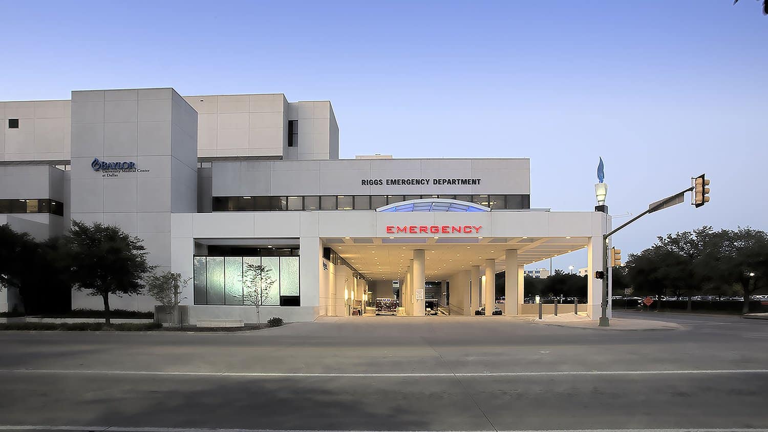 Hospital emergency department entrance at twilight.