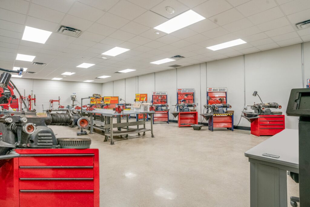 Auto repair shop interior with tools and equipment.