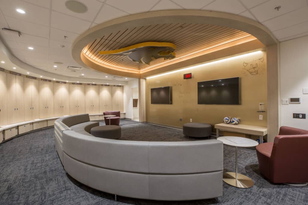 Modern conference room with circular seating and monitors.