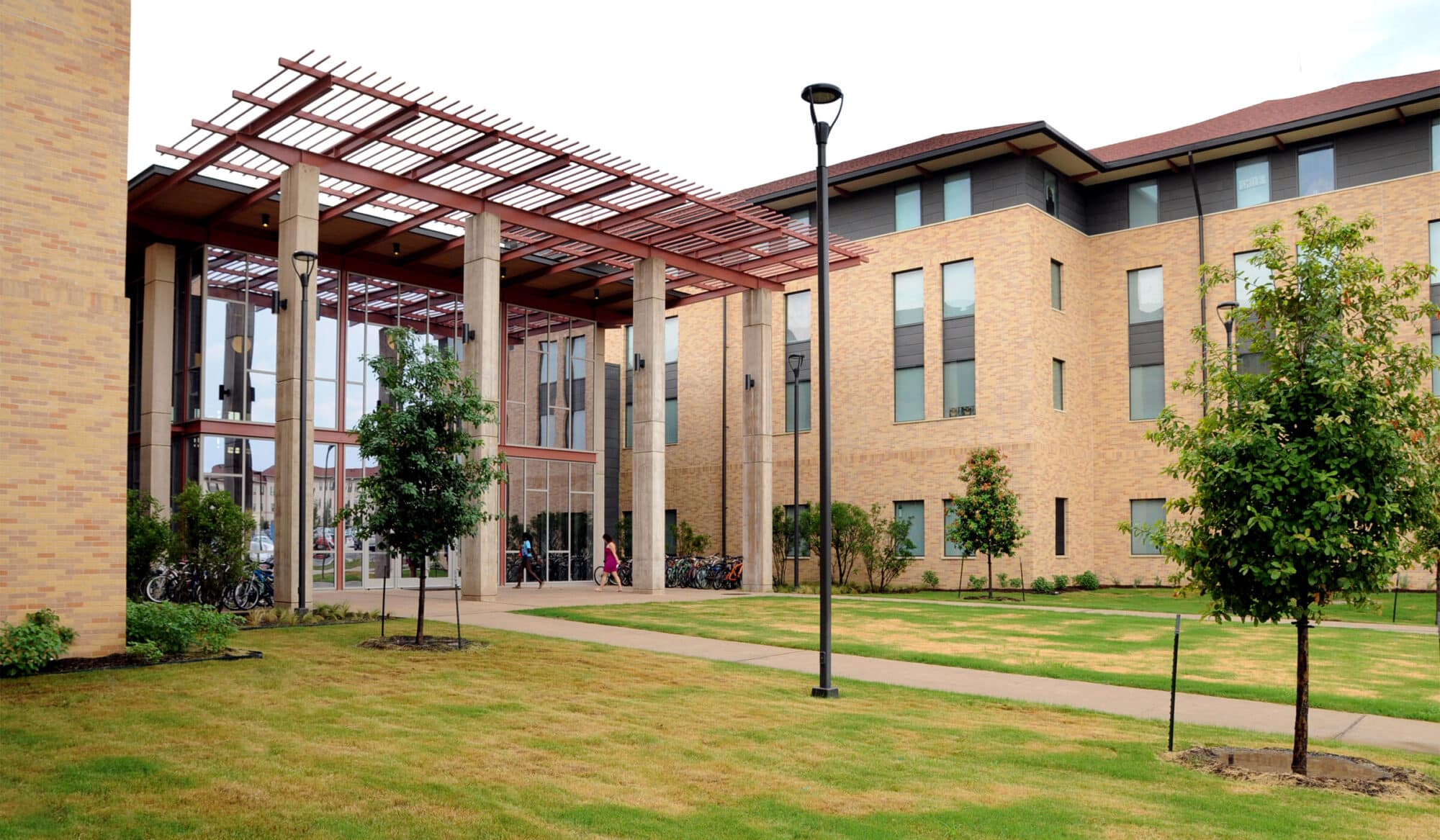 Modern university building with landscaped garden.