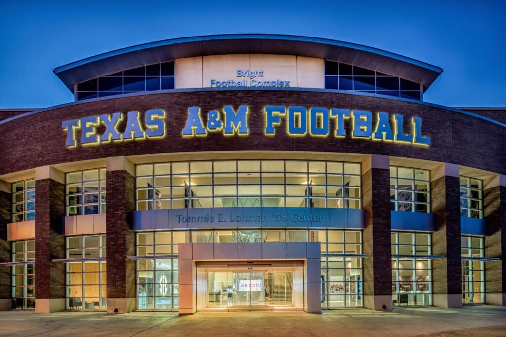 Texas A&M Football Complex entrance at twilight.