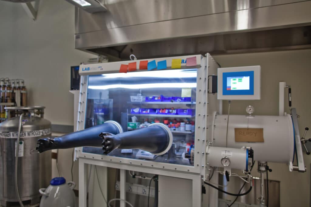 Laboratory robotic arm inside a research facility.