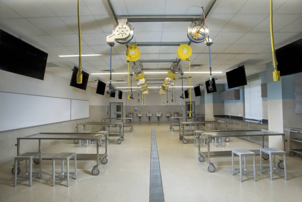 Modern autopsy room with stainless steel tables.