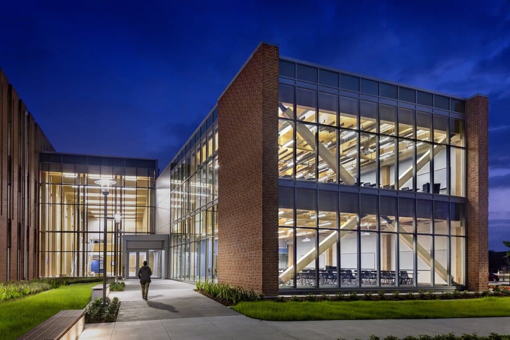 Modern illuminated building exterior at dusk.