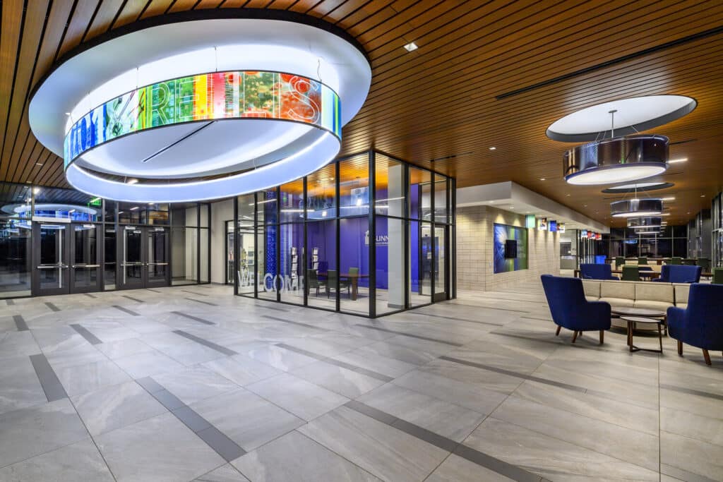 Modern lobby with circular LED lights and wooden accents.