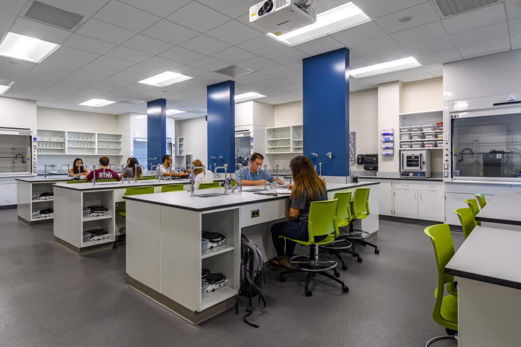 Modern laboratory with students working at benches