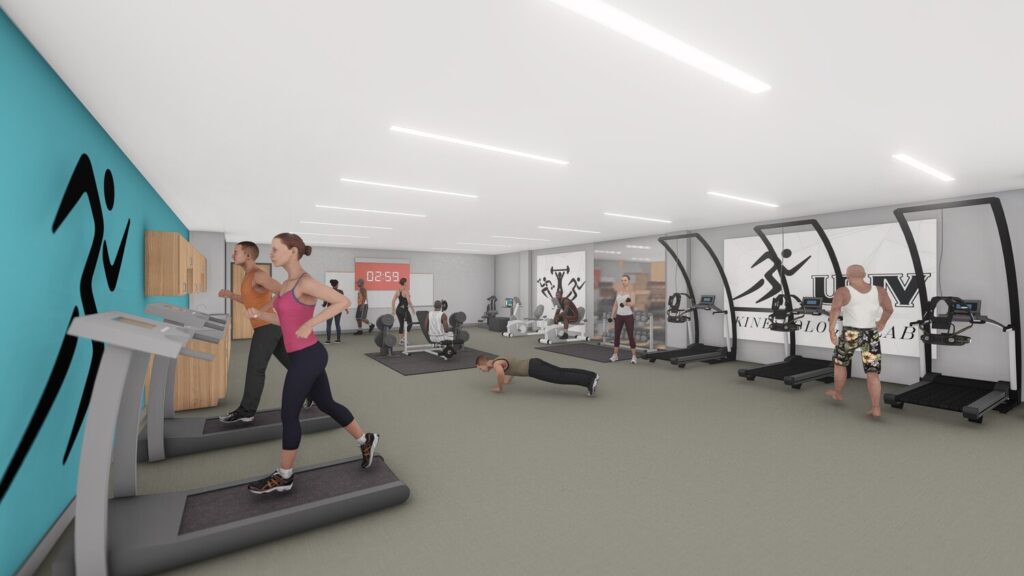 Modern gym with people exercising.