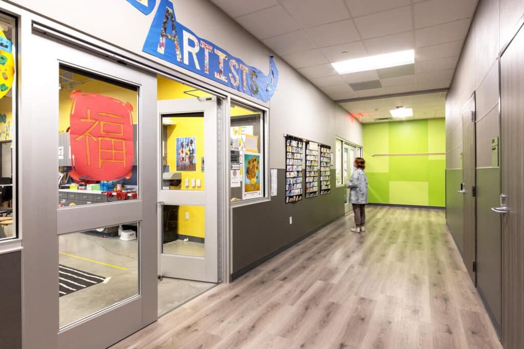 Colorful school art gallery hallway with student artwork.