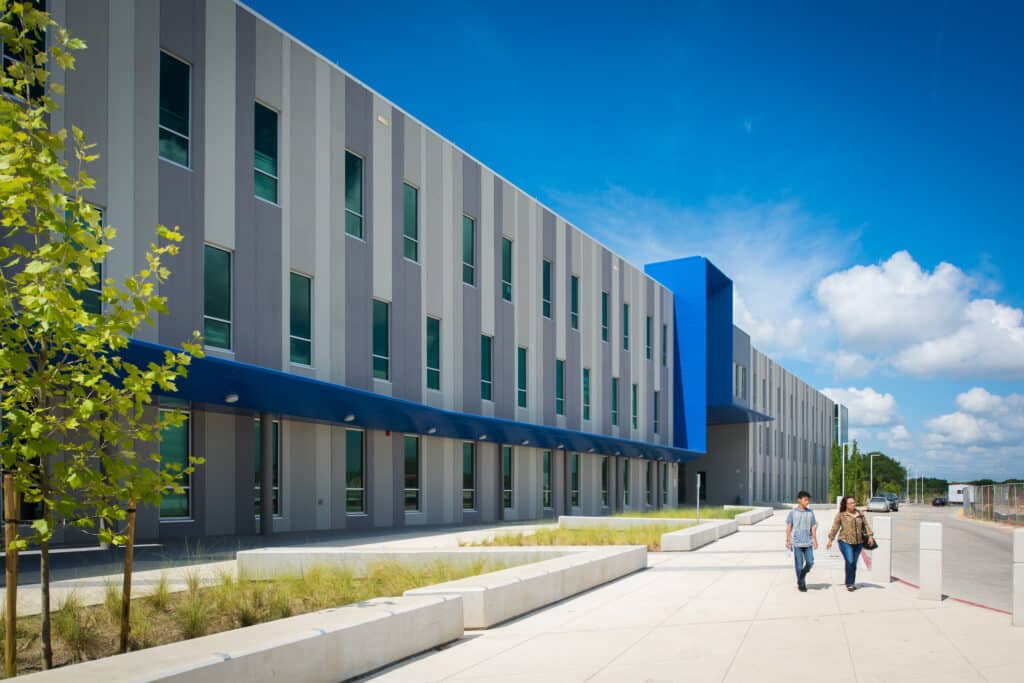 Modern building exterior with walking pedestrians