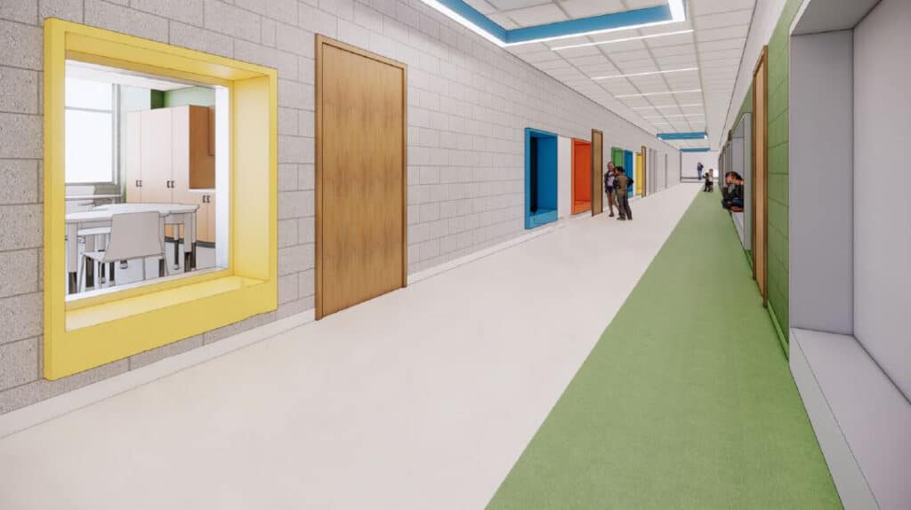 Colorful school hallway with students and open door.