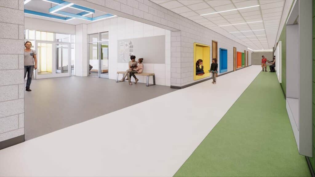 Modern school corridor with colorful doors and students.